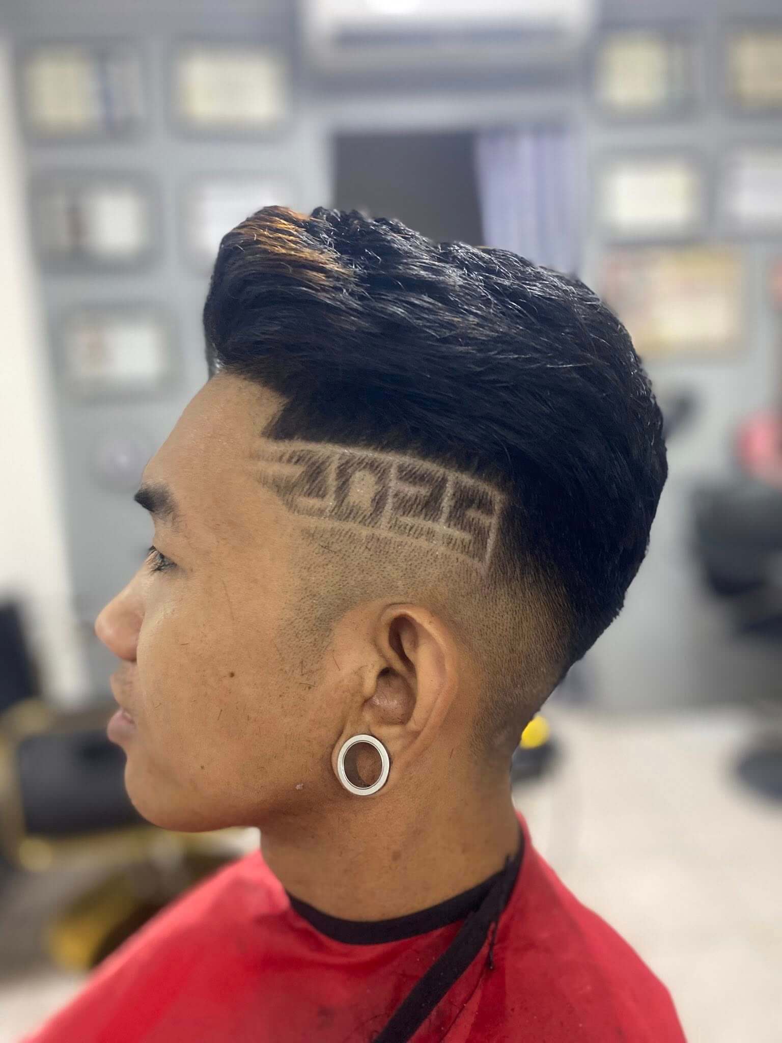 Trendy men's hairstyle with neat fade and styled top